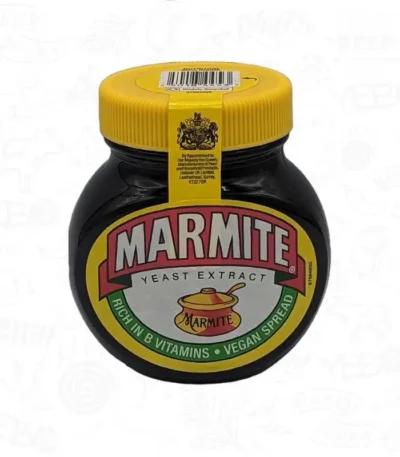 A black jar of marmite spread vegetable extract with a yellow lid