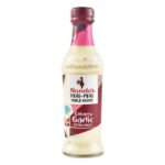Nando’s Creamy Garlic Extra Mild Peri-Peri Sauce bottle with rich, smooth texture.